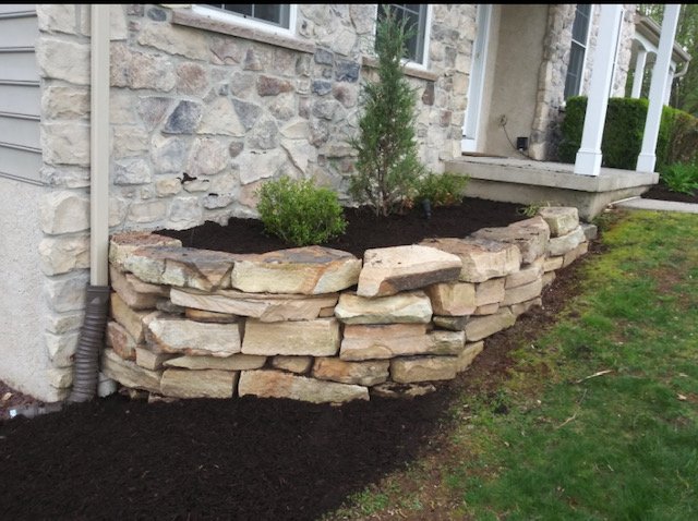 Raised bed with rock wall
